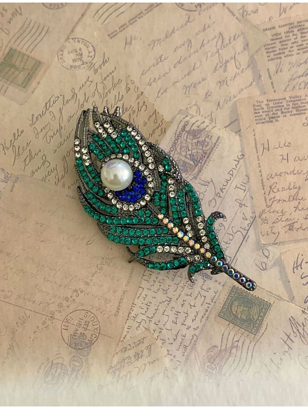 Sparkling Peacock Feather Brooch with Faux Pearl Accent
